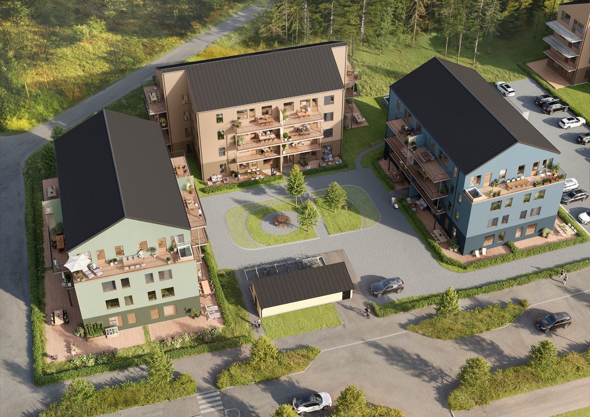 Brf Terrasshöjden sedd från gatan med putsade fasader och balkonger